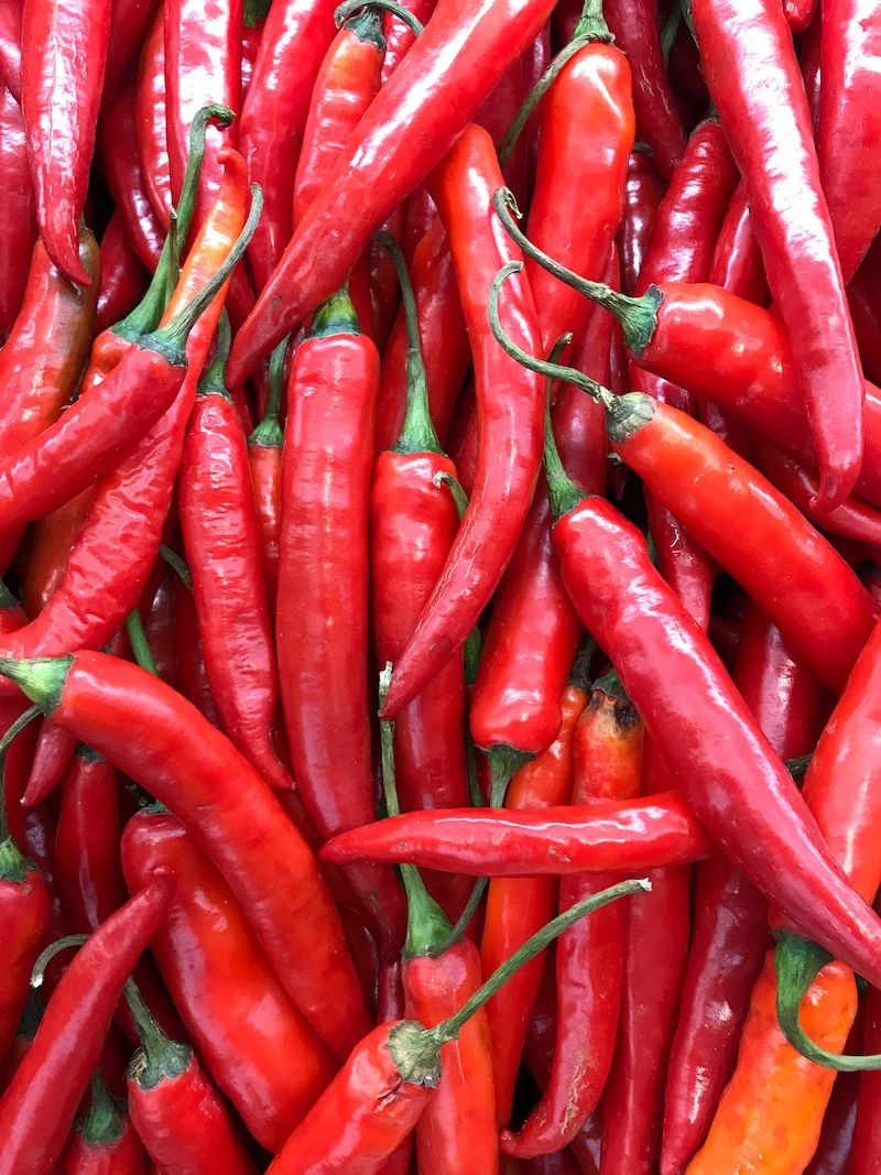 a bunch of cayenne peppers in a bunch