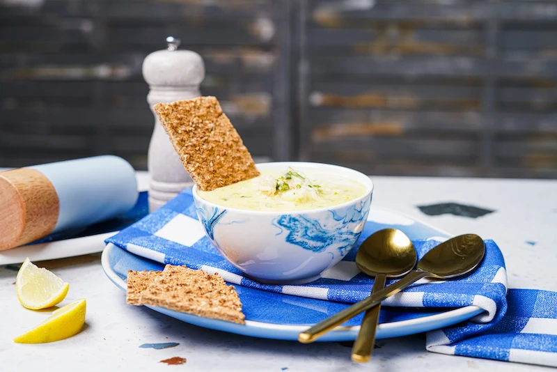 coconut shrimp soup in a blue and white bowl