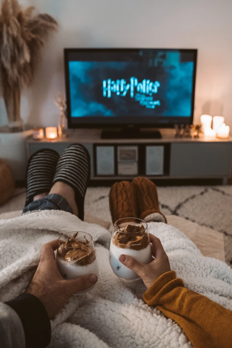 couple snuggled up watching harry potter