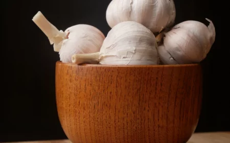garlic in a bowl made of wood