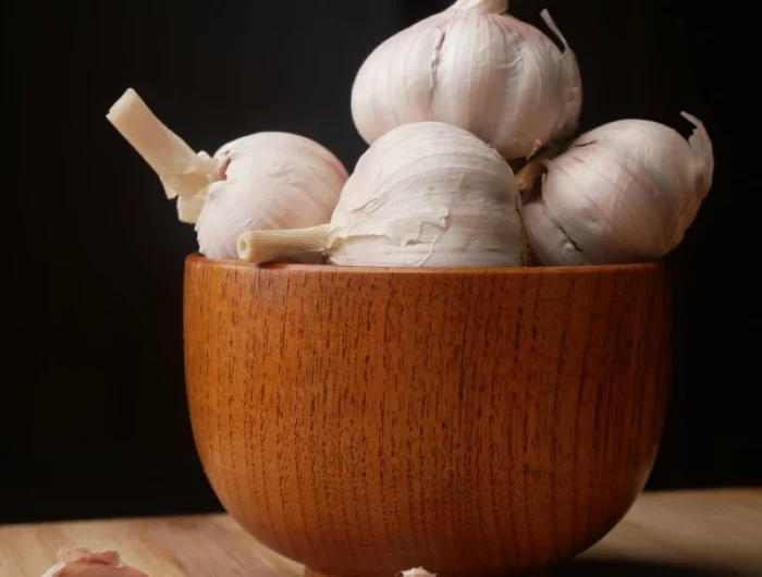 garlic in a bowl made of wood