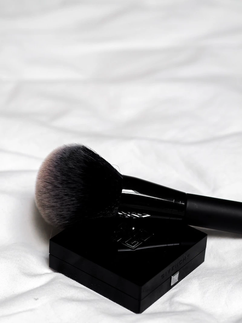 how to clean your makeup brushes black makeup brush on top of pallete