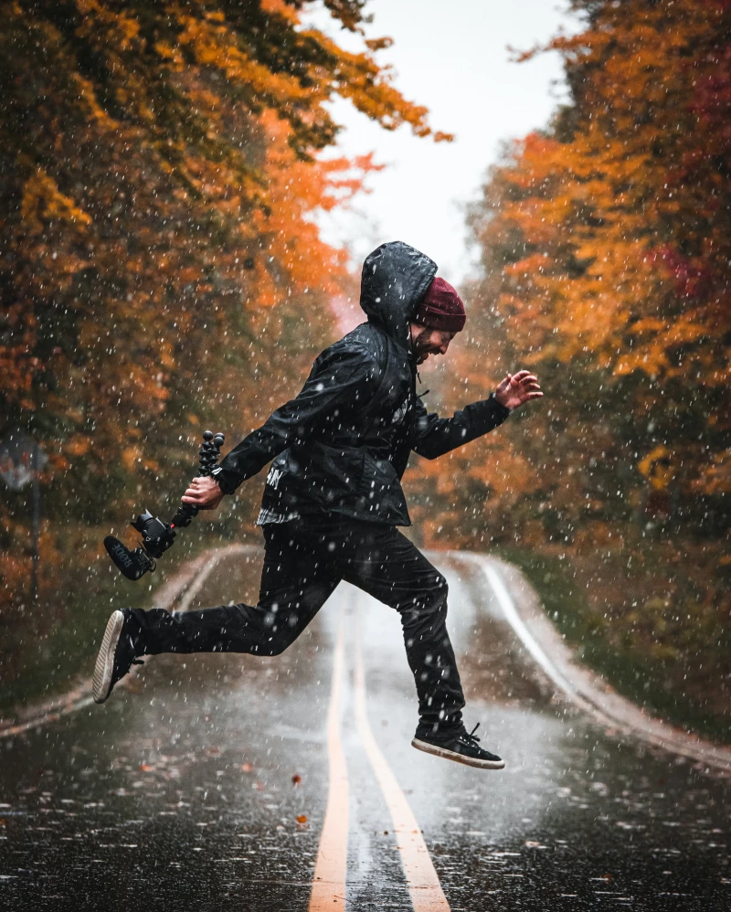 man jumping in the rain