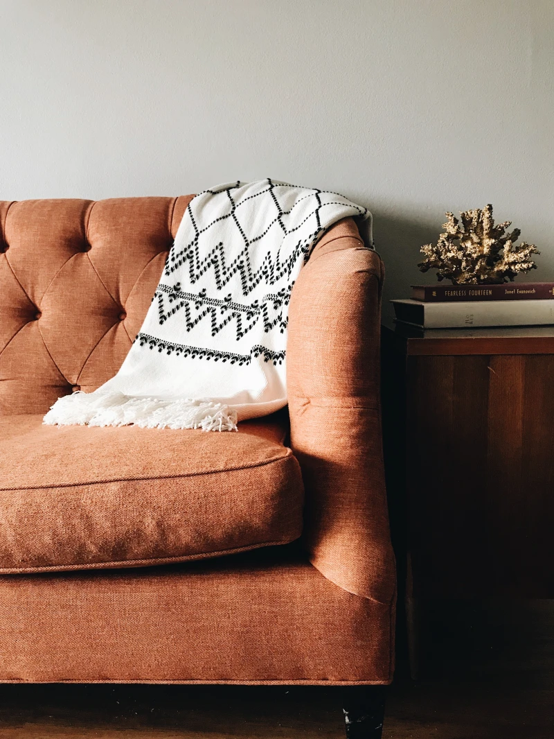 red chair with white and black blanket