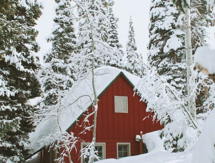 red house covered in snow