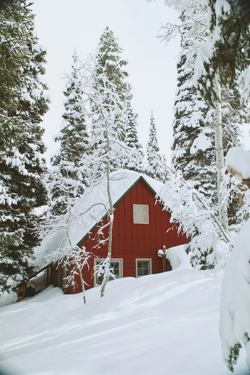 red house covered in snow