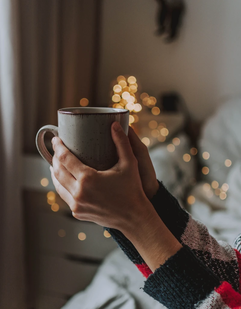 teas for a strong immune system woman holding a cup of tea