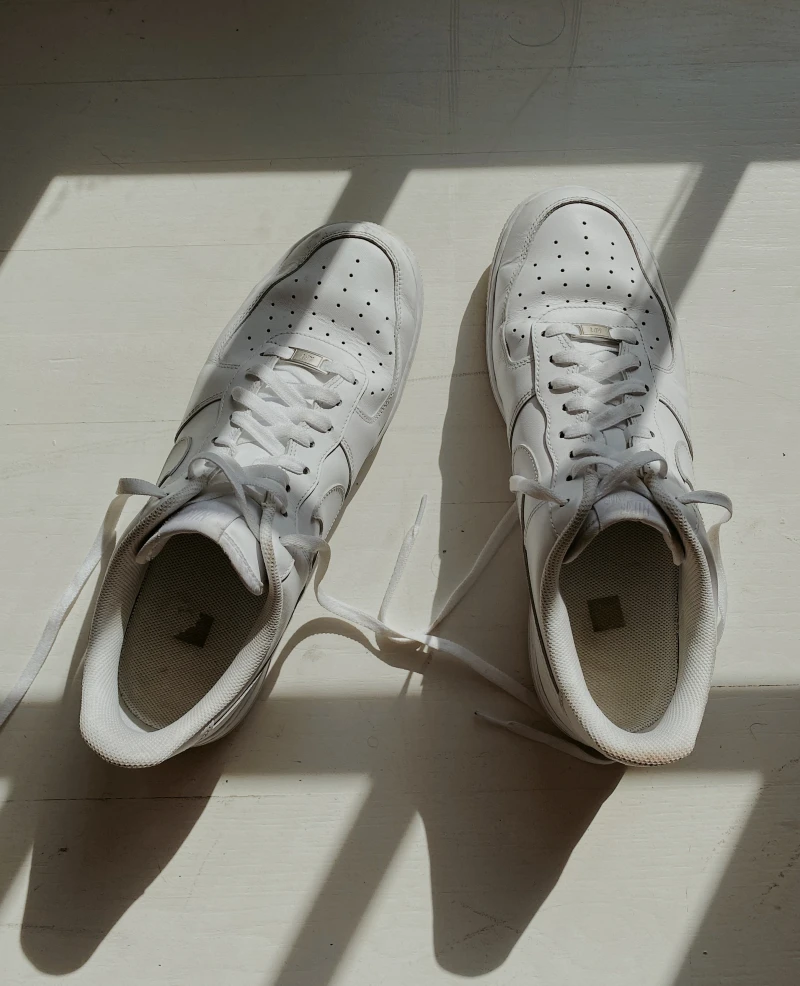 toothpaste hacks pair of white shoes on floor