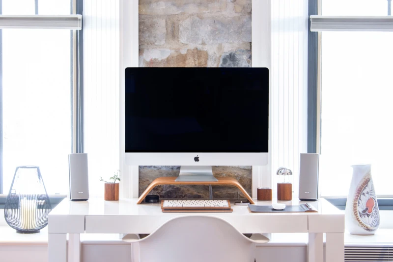 white mac on top of desk