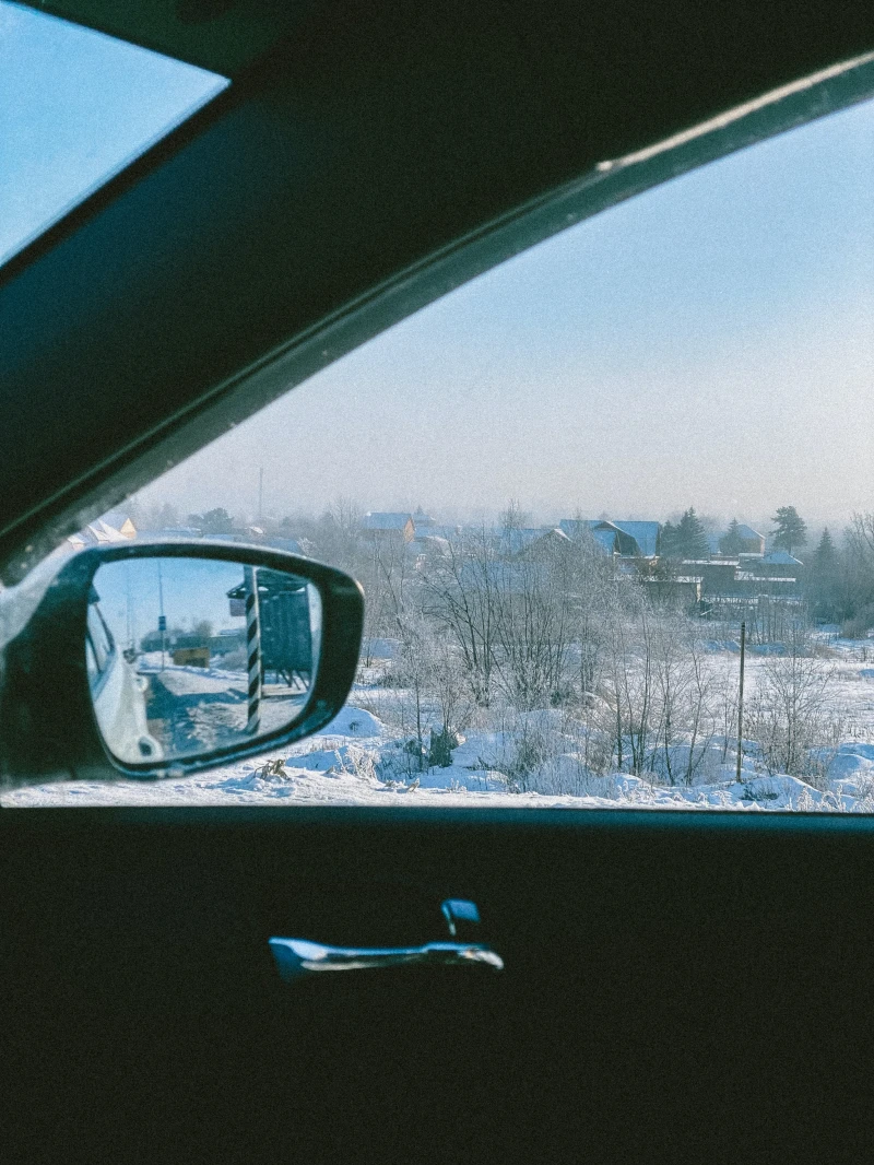 winter field through car window