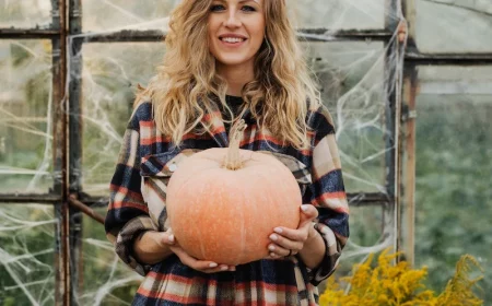 woman holding a pumpkin