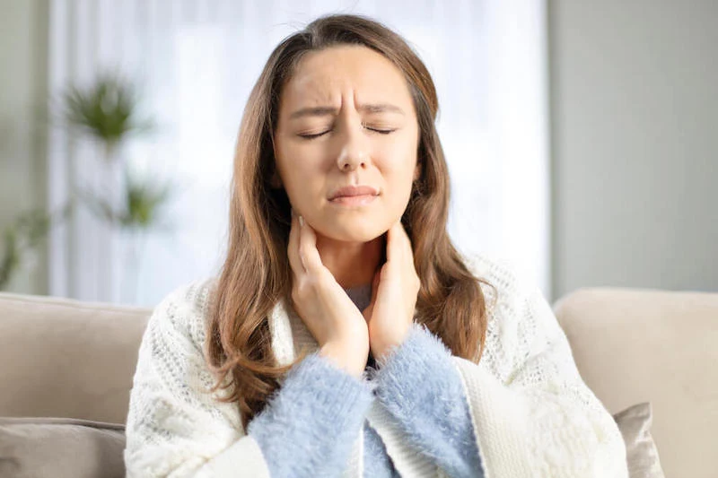 woman with a sore throat