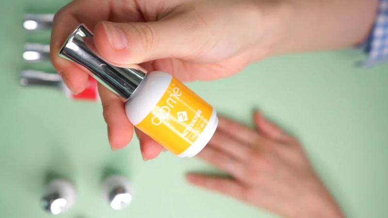 applying activator on nails
