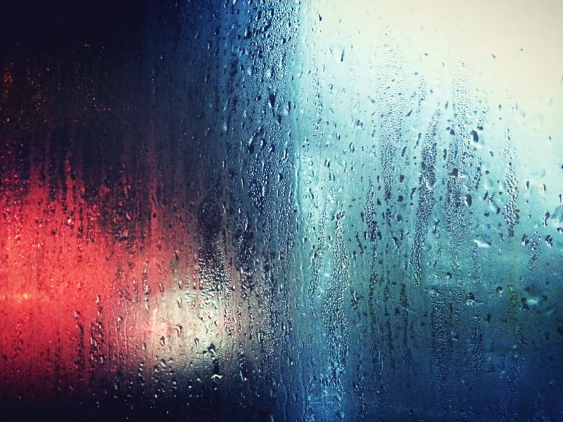 condensation on window with red and blue