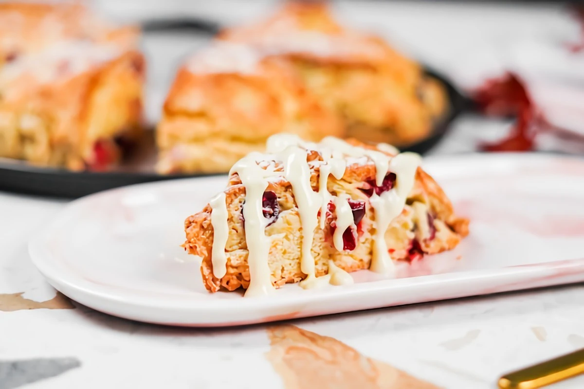 cranberry orange scone with melted white chocolate