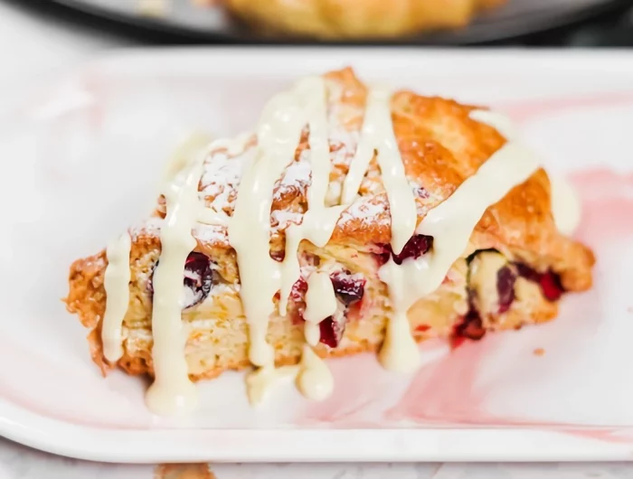 cranberry orange scones with melted drizzled white chocolate