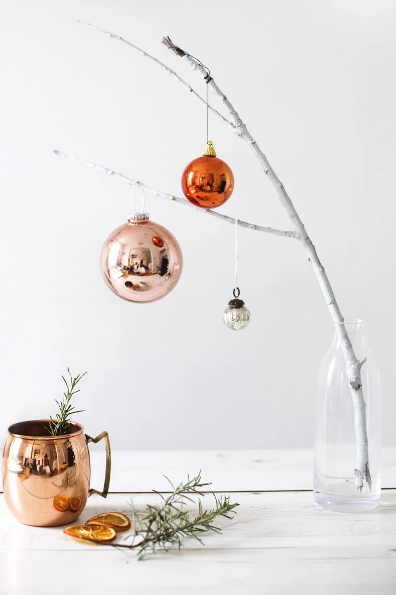 diy christmas decorations painted tree branch with baubuls