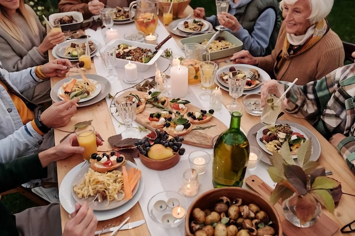 people sitting at a table and having dinner