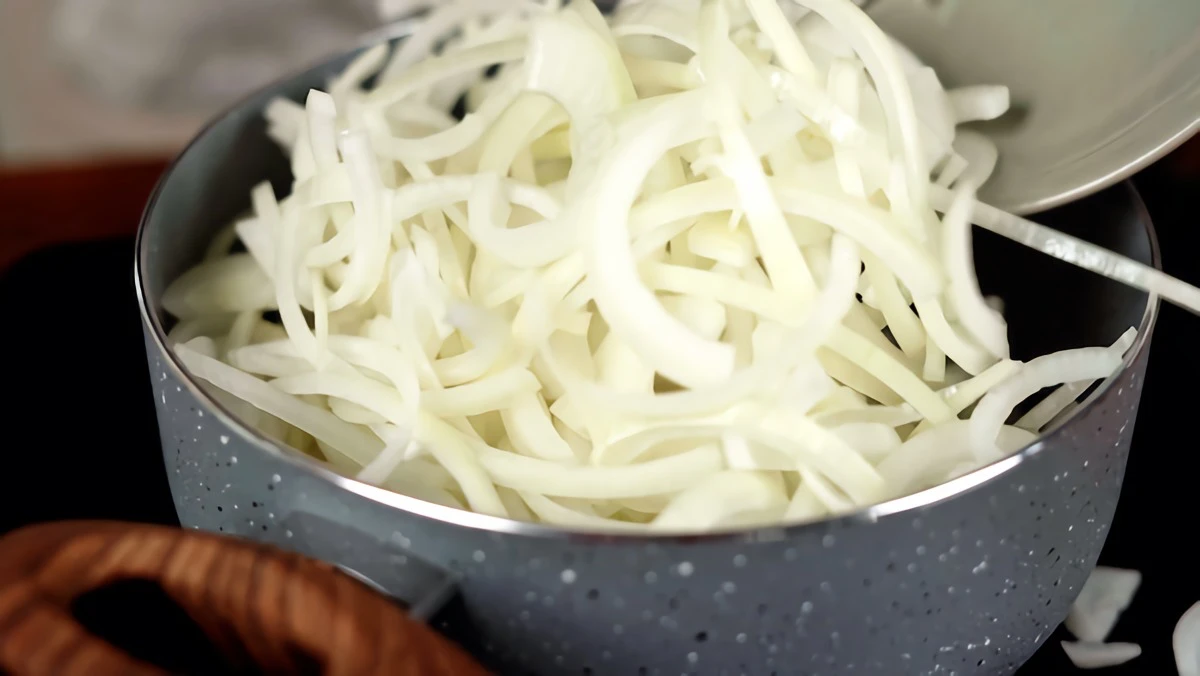 thinley sliced onions in a pot