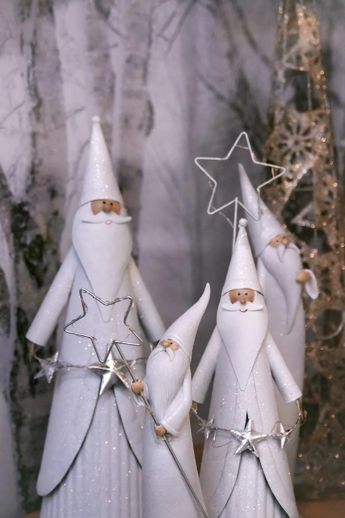white wooden christmas figures