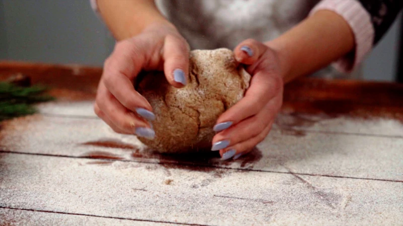 whole wheat cinnamon rolls kneading dough into a ball