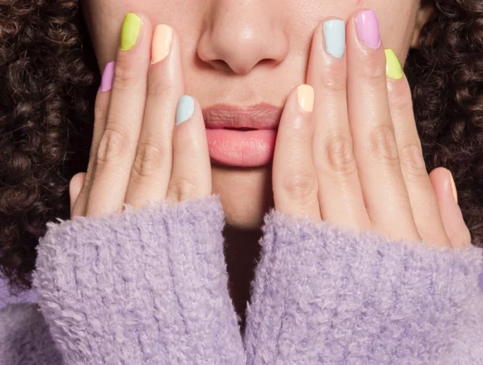 woman with every nail different color