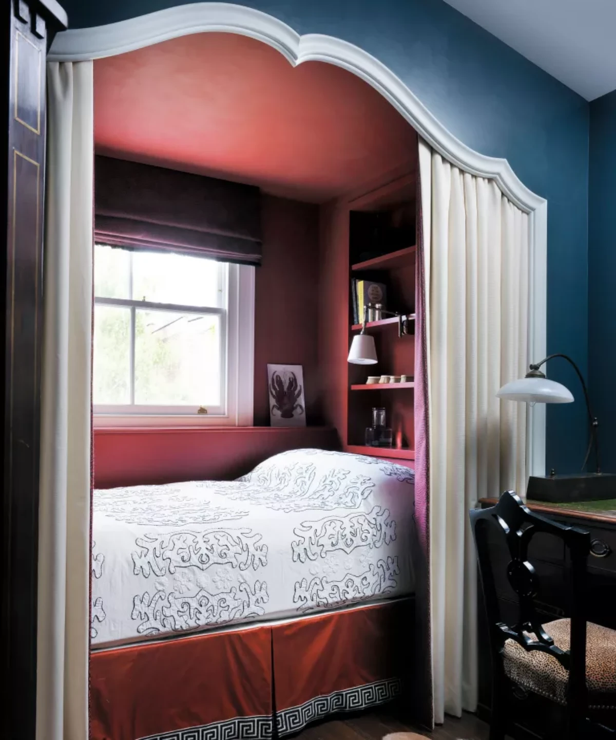 bed in a red alcove