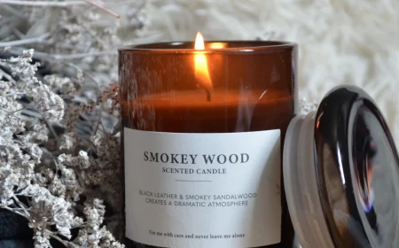 burning candle in brown glass