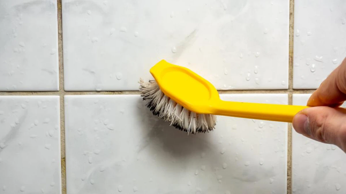 cleaning grout with brush