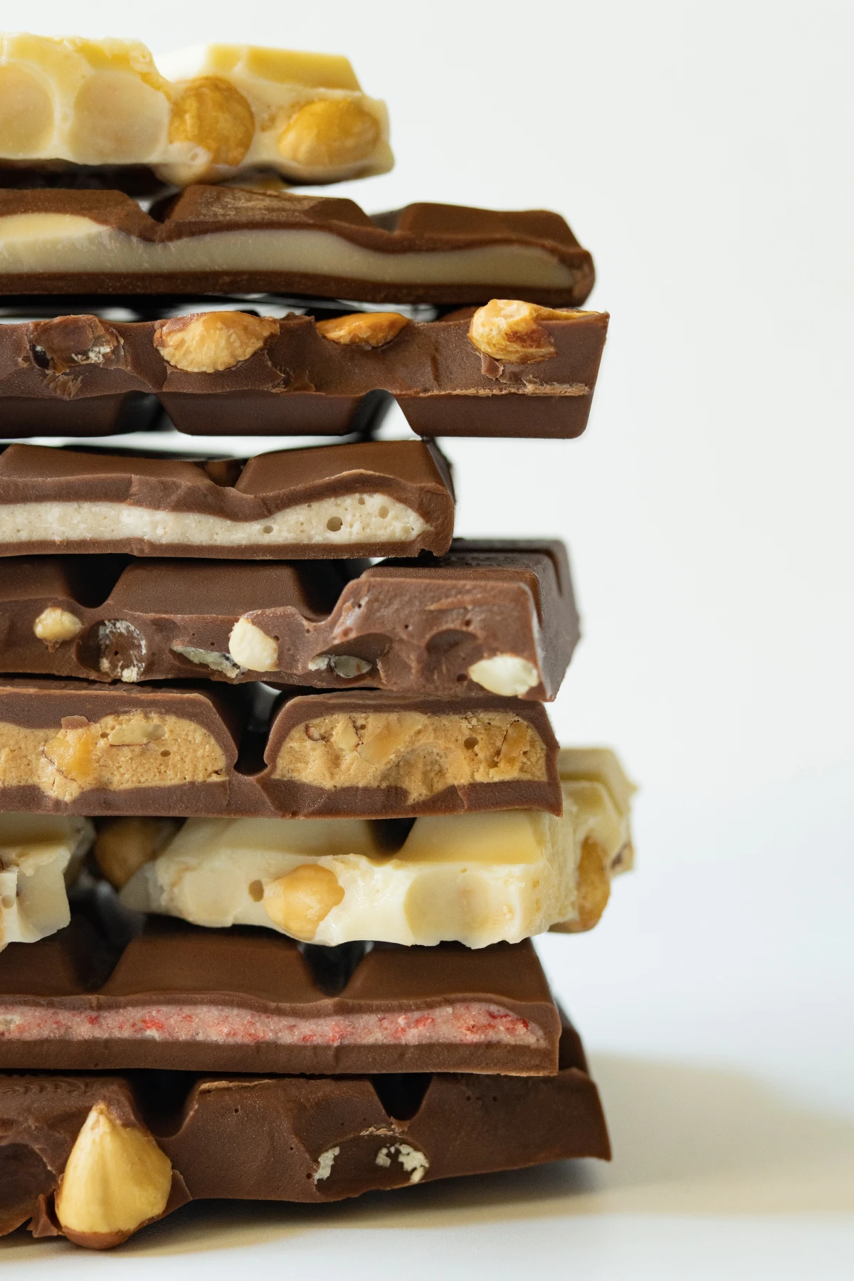 different types of chocolate bars stacked