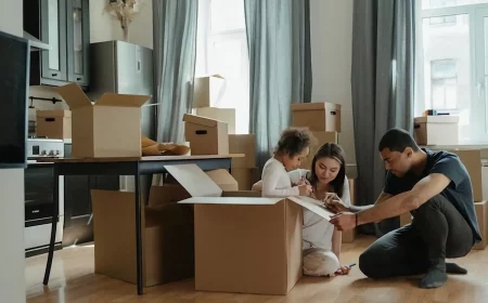 family in between moving boxes