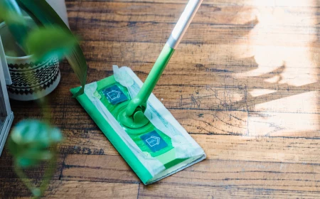 how to clean hardwood floors person moping the floors