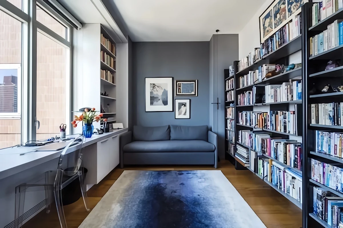 light gray blue colored wall with books