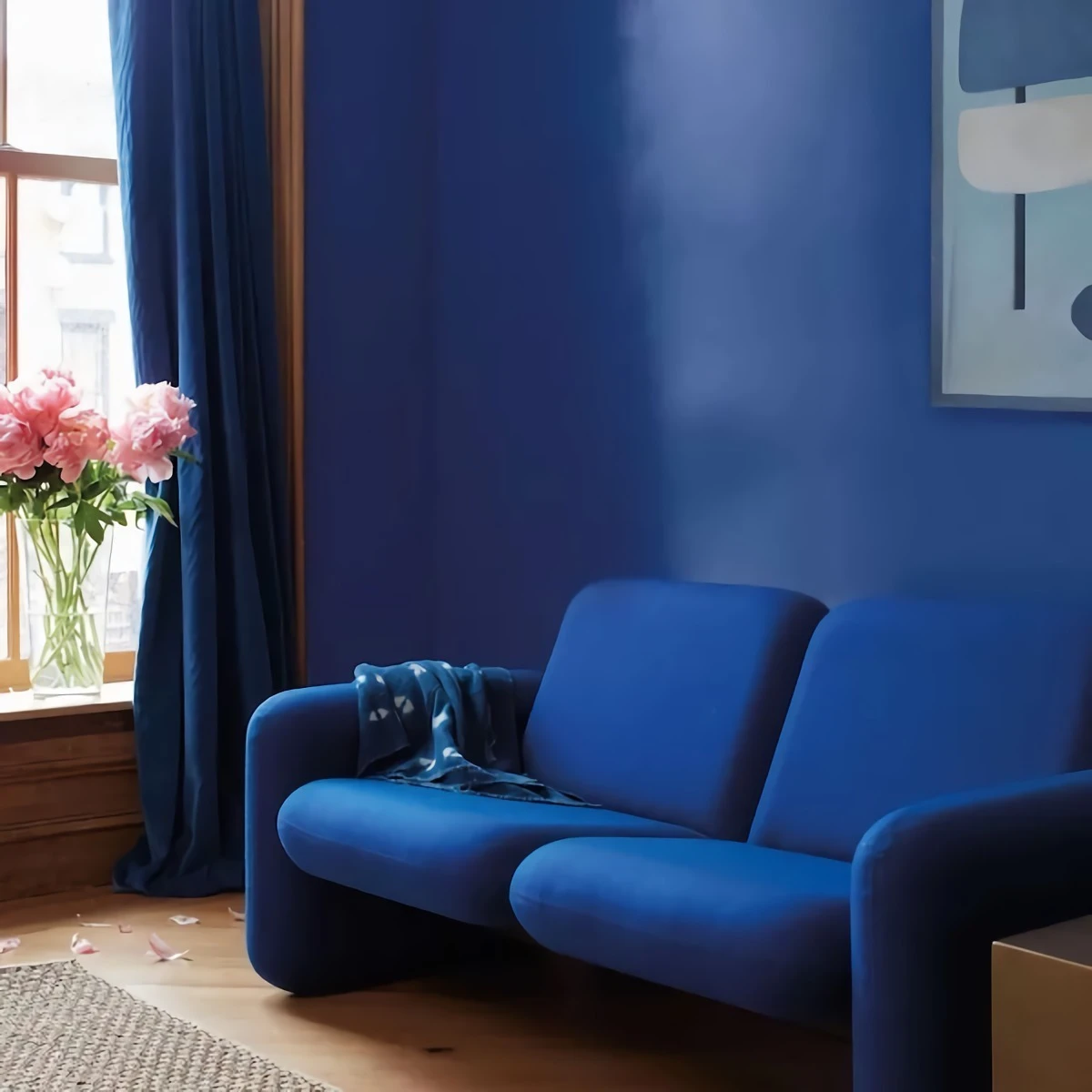 paint color trends deep blue wall and couch