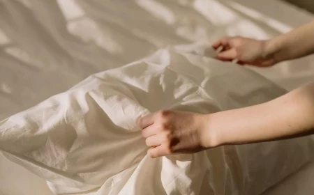 person grabbing a pillow