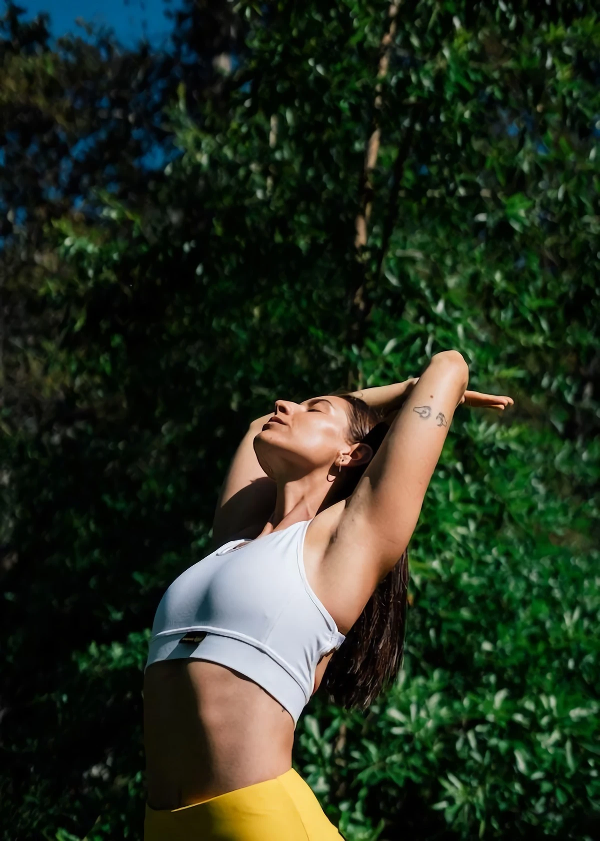 signs of a good workout woman streching in nature