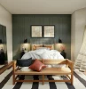 small bedroom with green painted boards