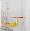 squeegee cleaning shower glass door