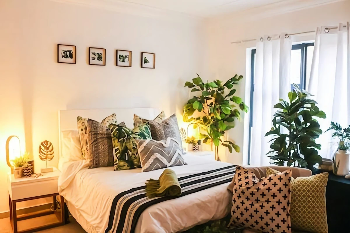 textured pillows on white bed linens