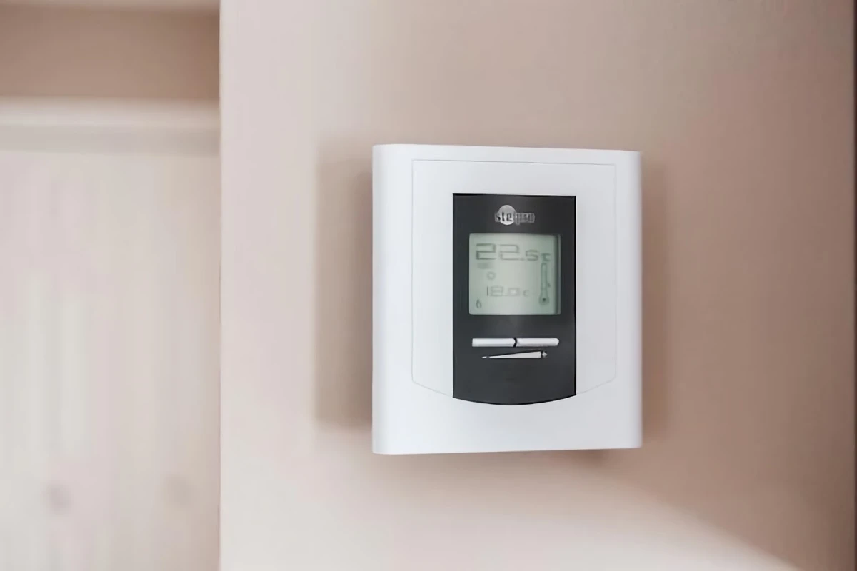 thermostat sitting on the wall