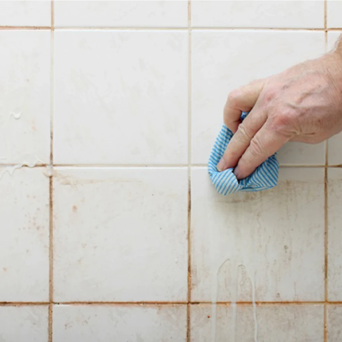 wiping of dirty grout