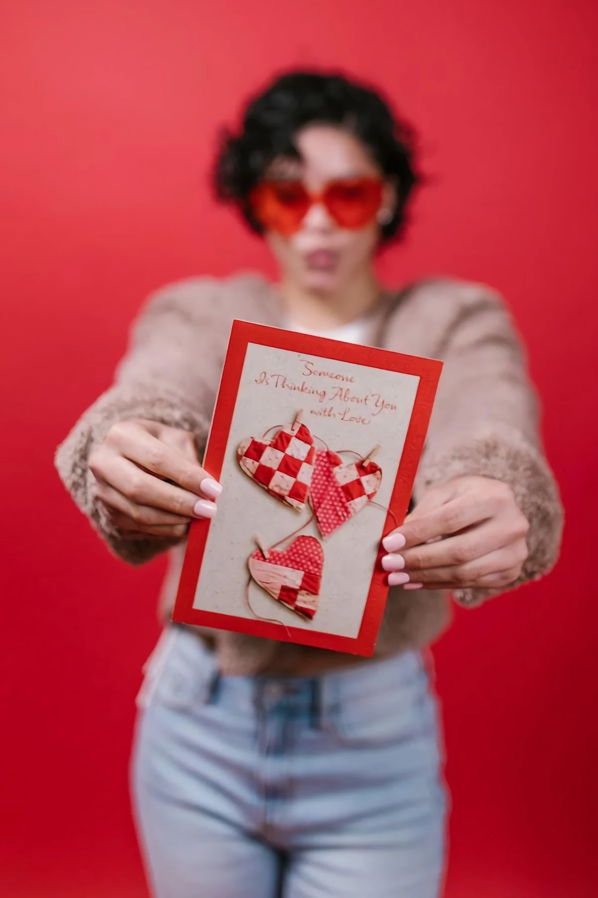 woman holding a valentines day card