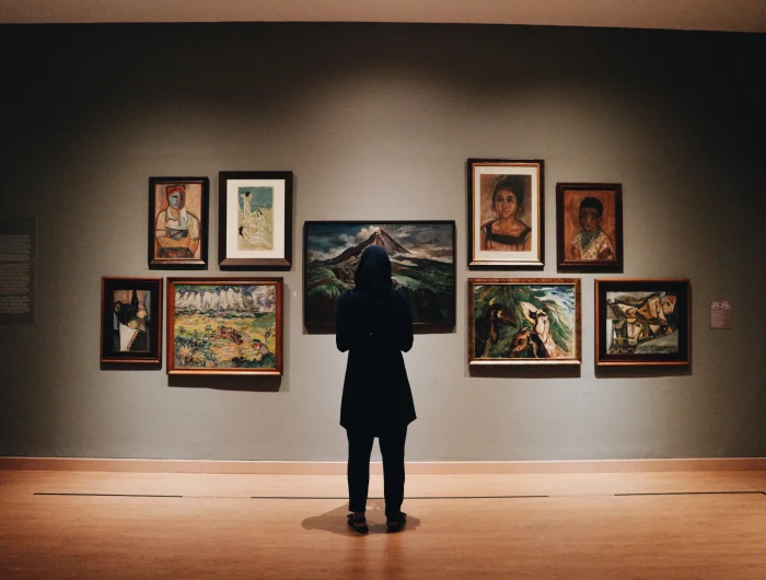 woman looking at a gallery wall