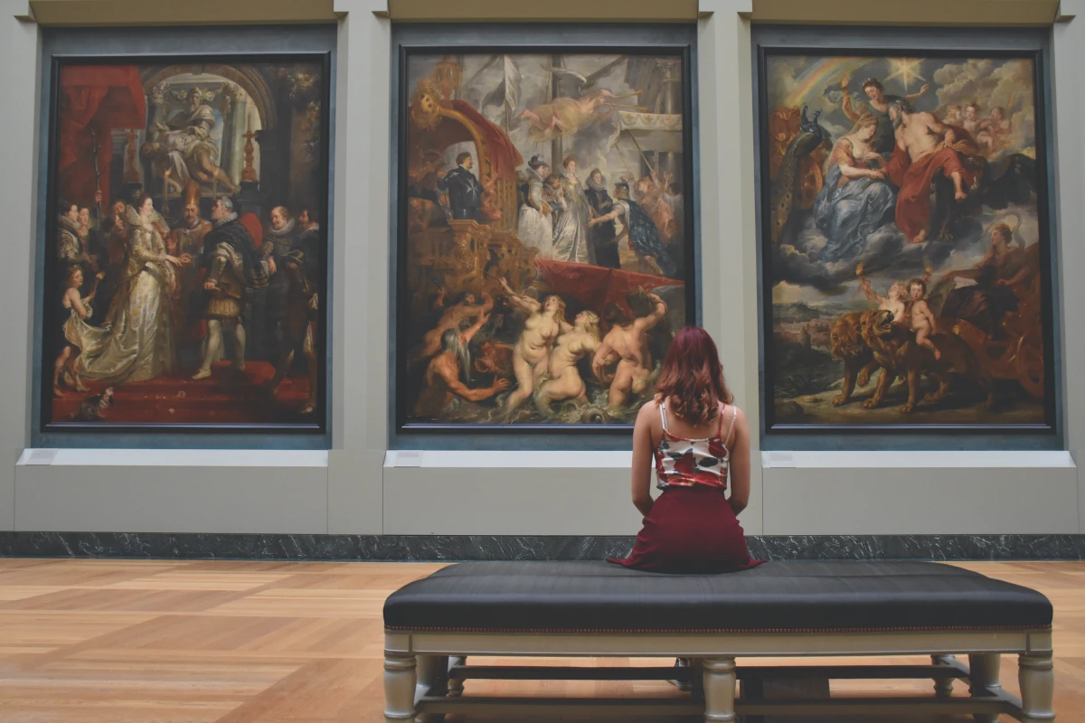 woman sitting in a museum