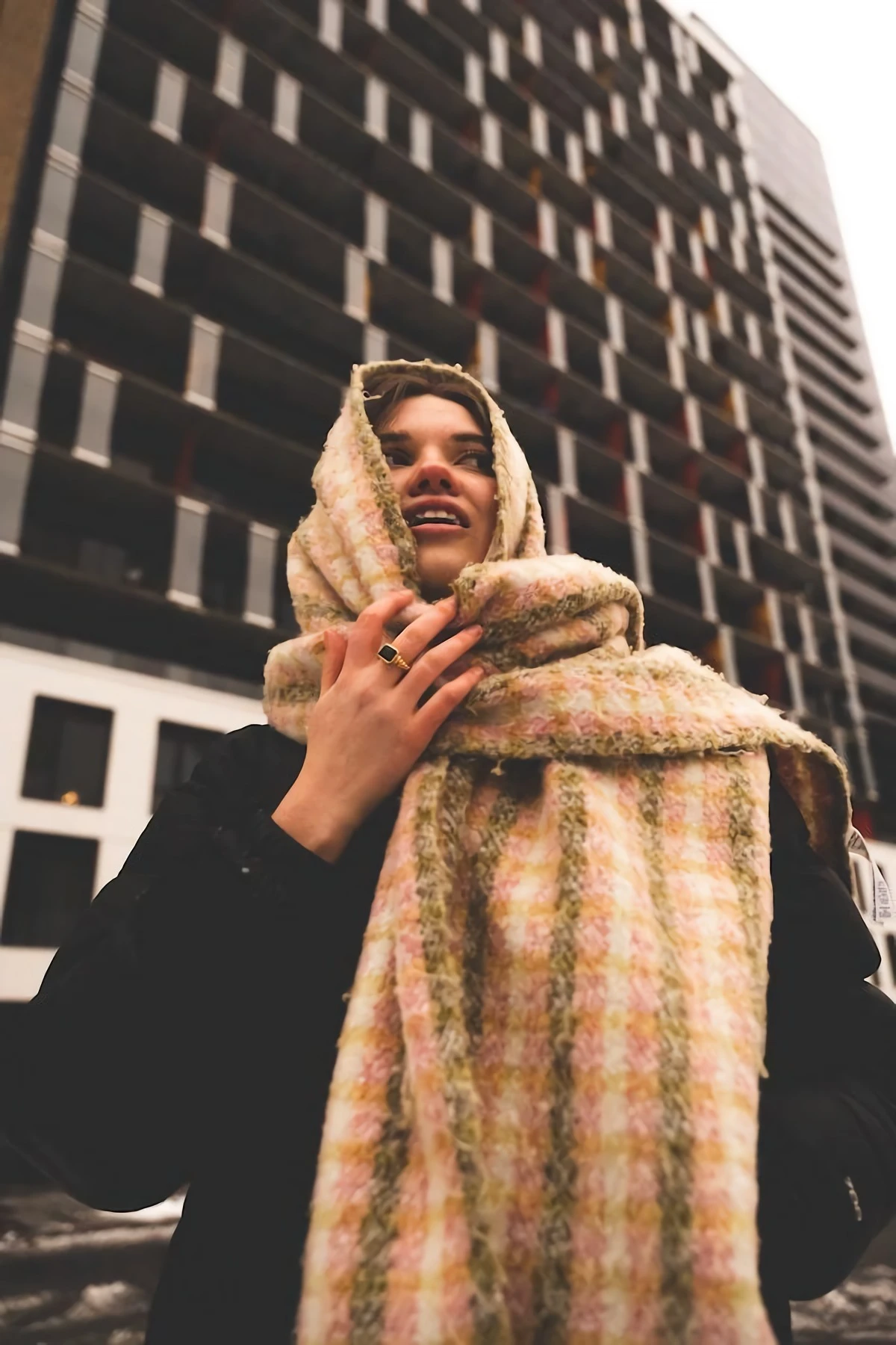 woman wrapped in big chunky scarf
