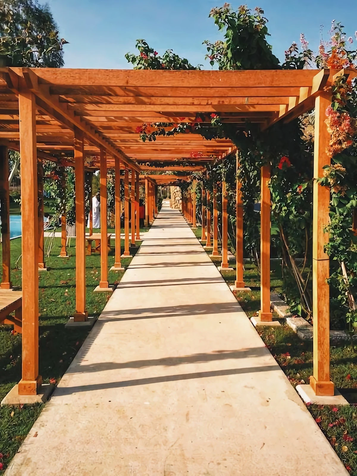 wooden brown arch over pathway