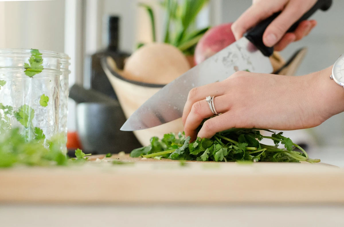 chopping herbs on a cutting board