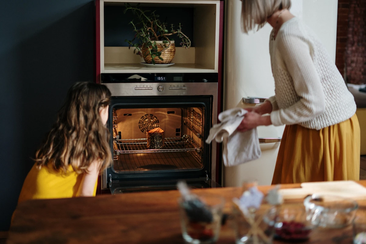 common cooking mistakes woman and child in front of open oven