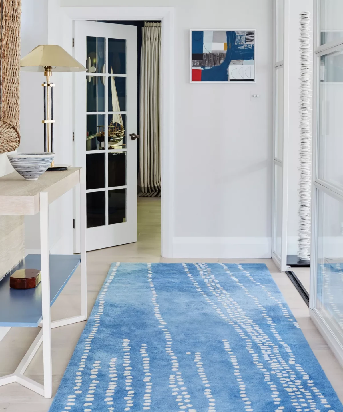 make a small entryway look bigger long blue rug in entryway