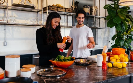 man and woman cooking dinner